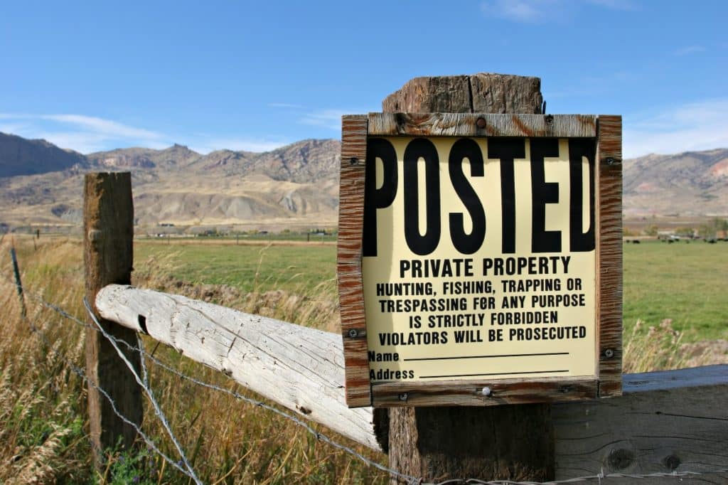 posted private property sign in the countryside