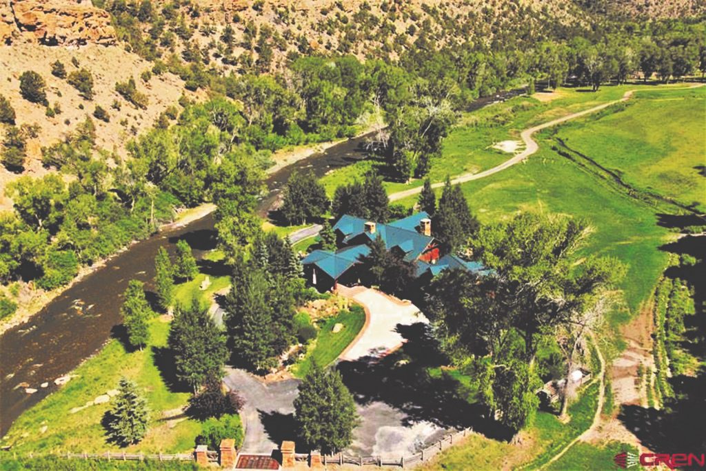 Aerial View of Centennial Ranch, featuring a 6,497 SF Home, Live Water and Lush Landscape- A Colorado Ranch For Sale